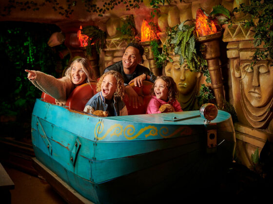 A family of four riding The Toucan Tours ride at Fantasy Island Theme Park, Ingoldmells
